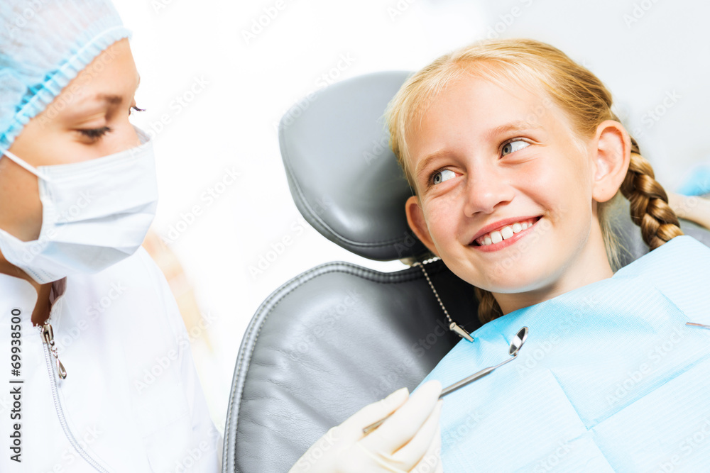 Dentist inspecting patient