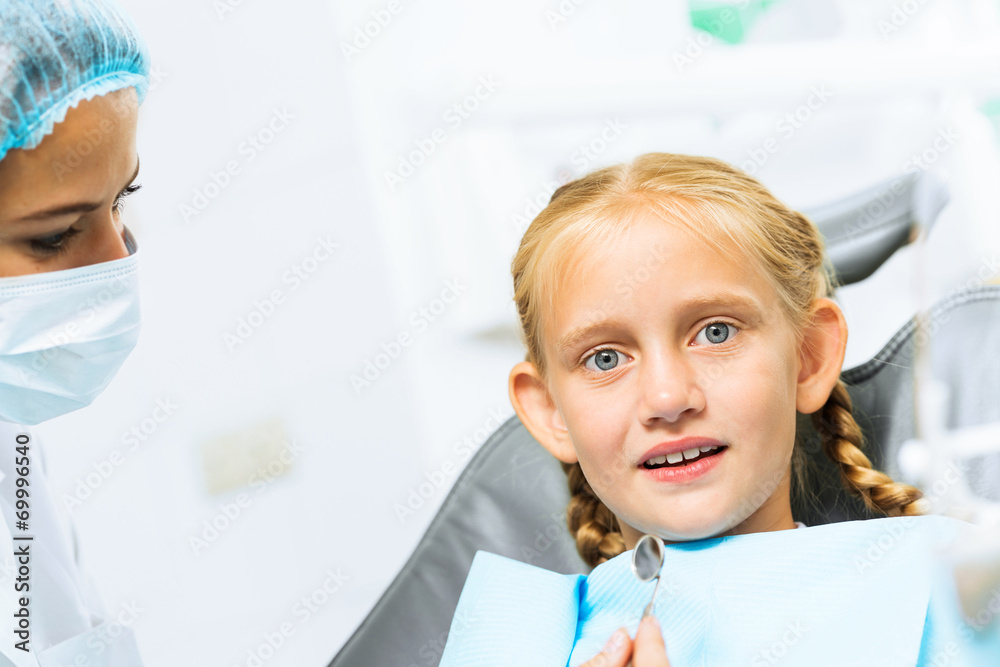 Dentist inspecting patient