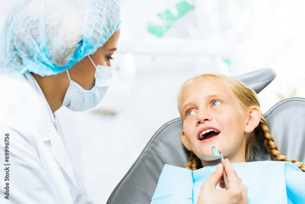 Dentist inspecting patient