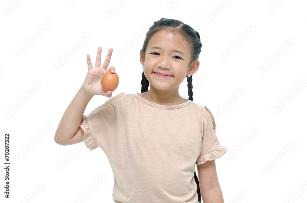 Asian girl smiiing and holding egg