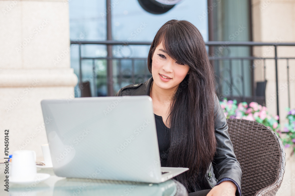 Young woman using computer