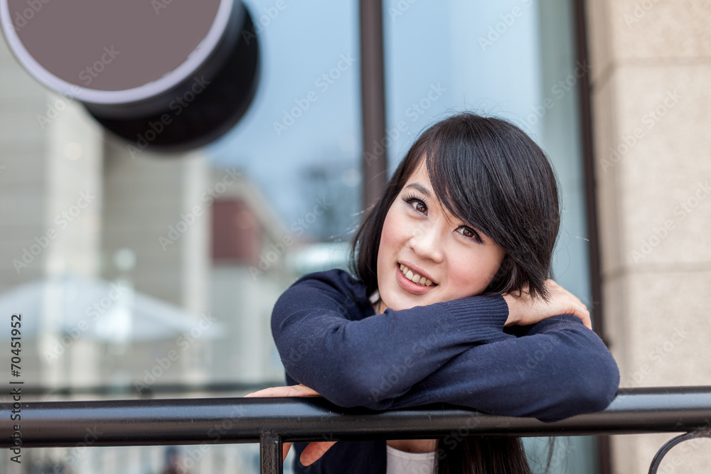 young asian woman at balcony