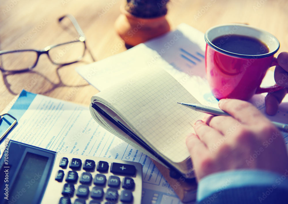 Businessman with Note and Calculator