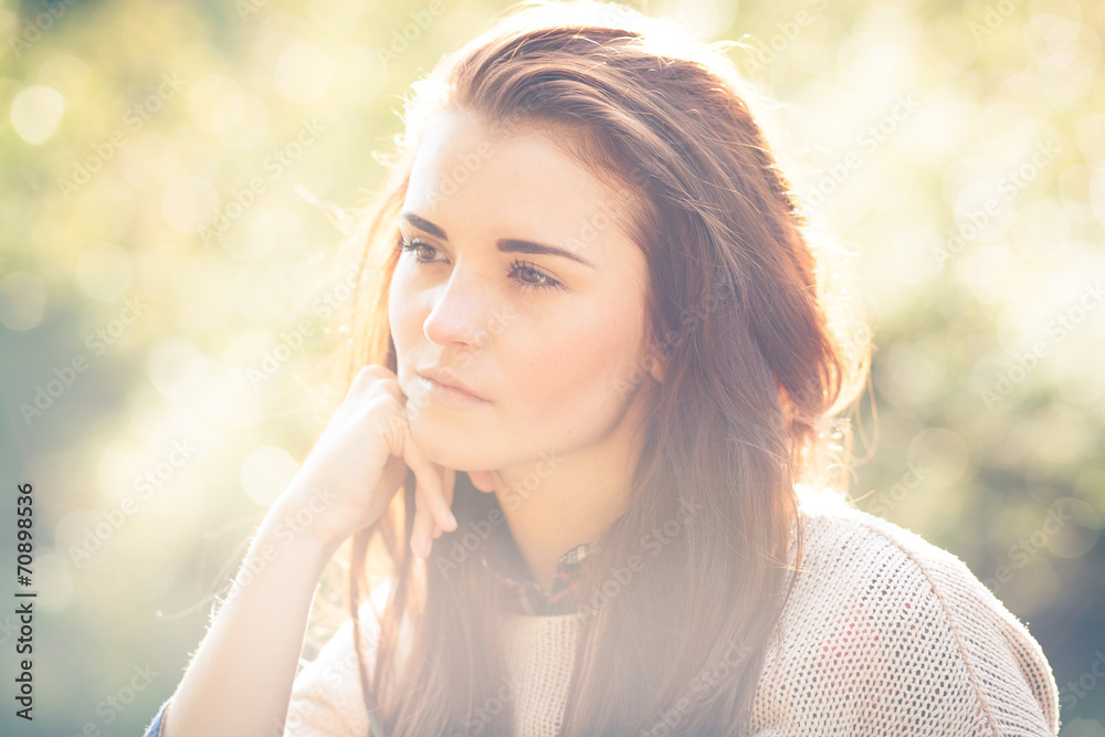 Young woman outdoor portrait, soft sunny daylight