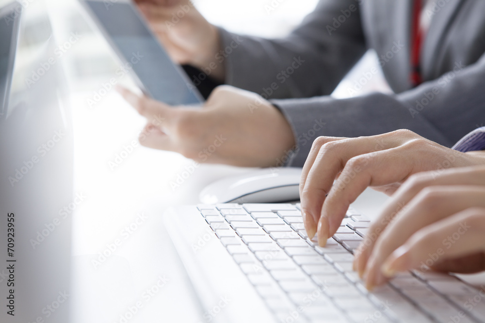 Hand rests on top of the keyboard