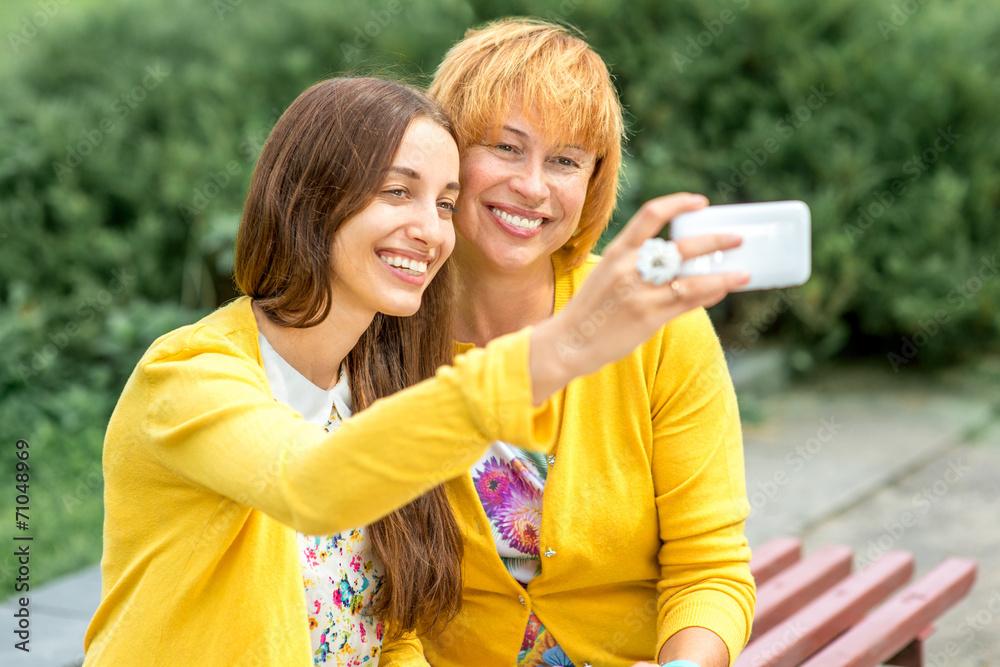 Portrait of mother with her daughter in the park