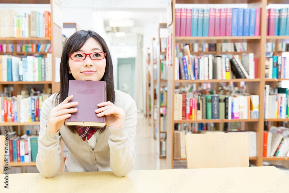 young asian student in the library