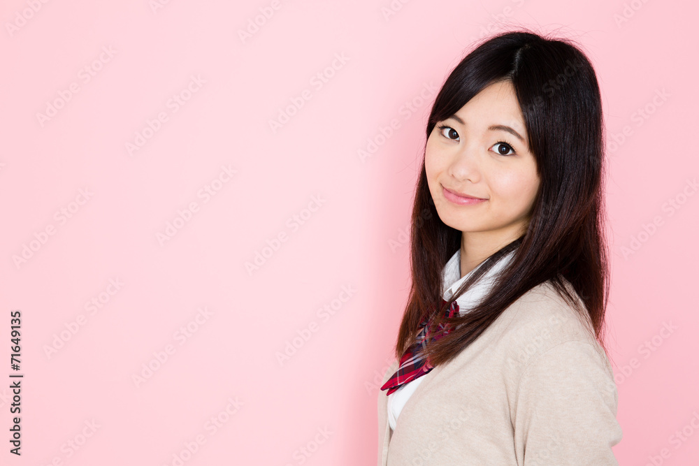 young asian woman on pink background