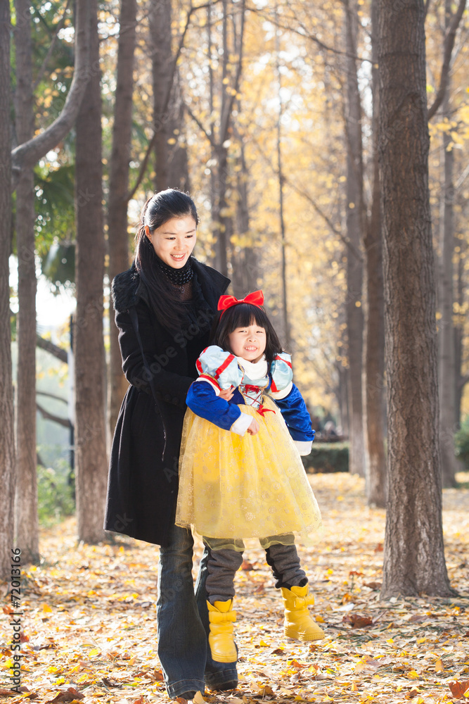 mother and daughter happy togetherness outdoor in forest