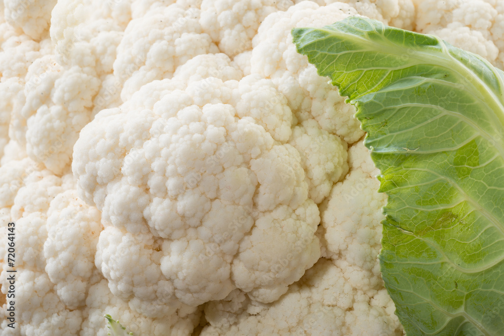 Organic cauliflower on wooden background