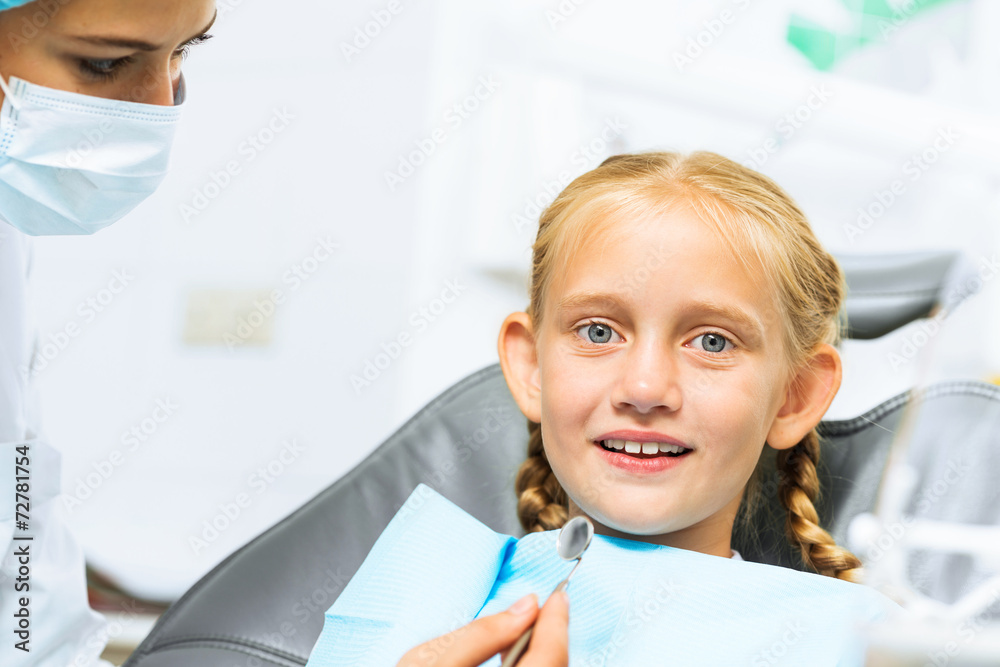 Dentist inspecting patient