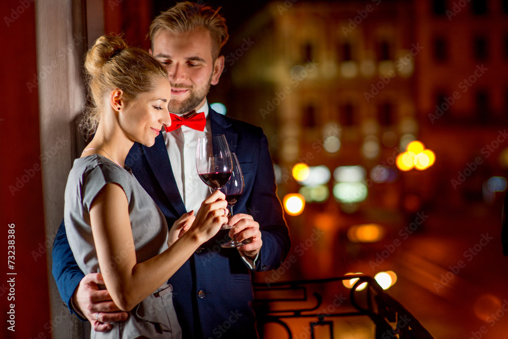 Loving couple on the night city background