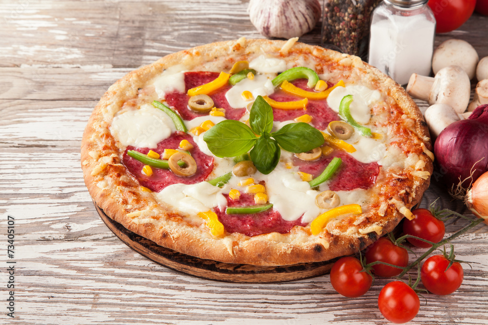 Delicious fresh pizza served on wooden table