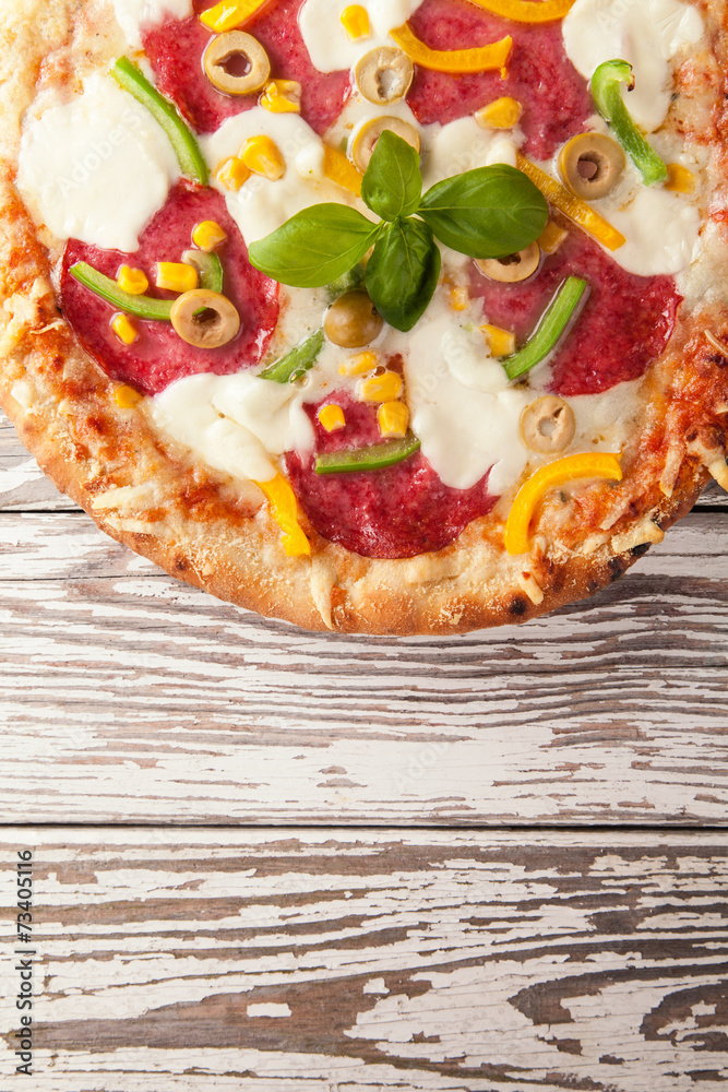 Delicious fresh pizza served on wooden table