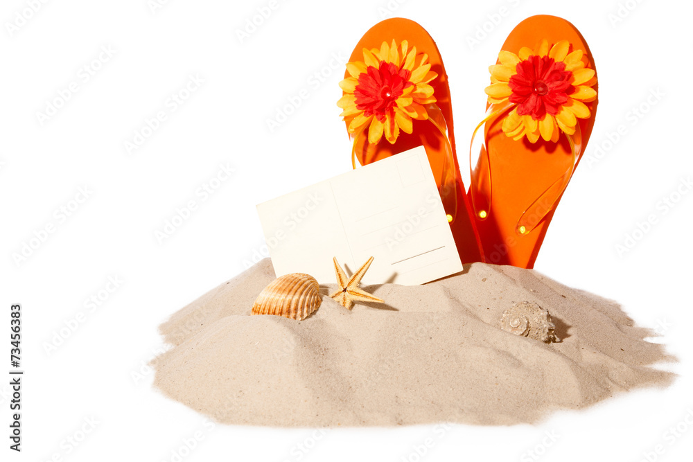 Beach concept with postcard and flip-flops