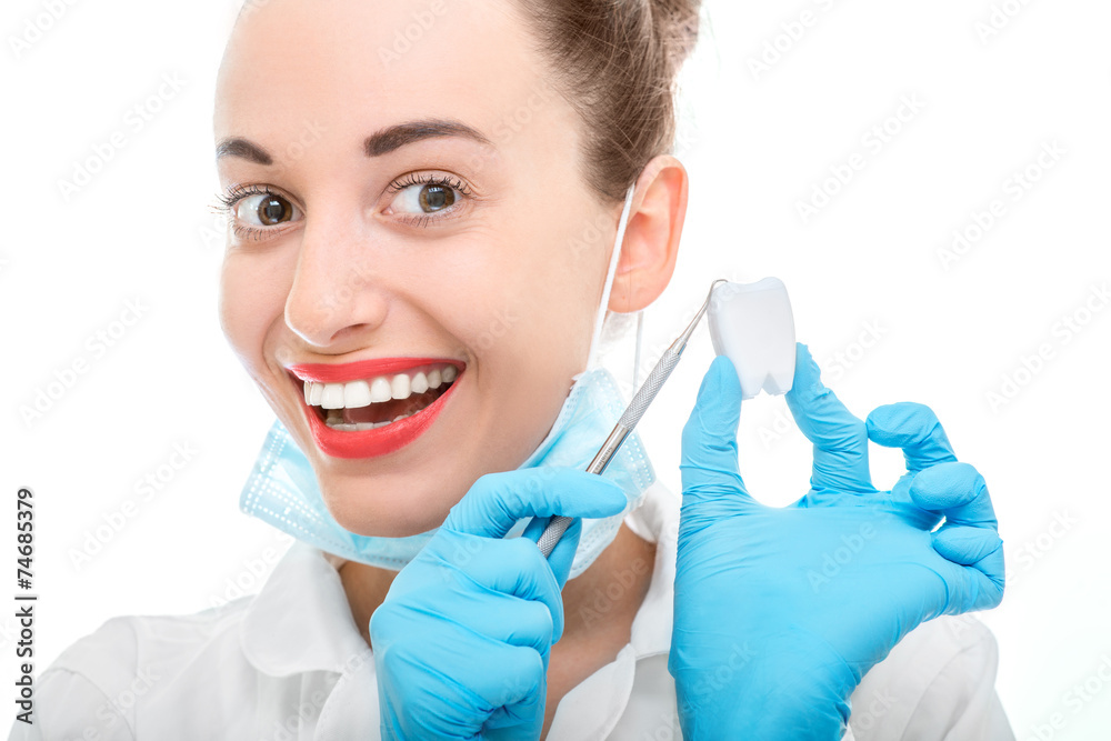 Portrait of young woman doctor on white background