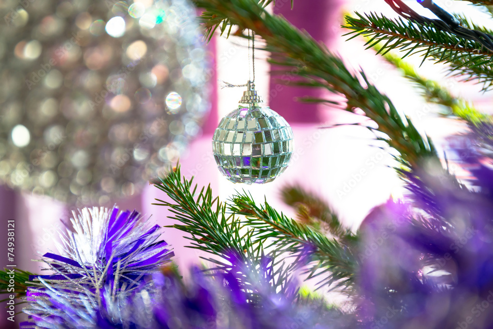 Beautiful purple and silver baubles on Christmas tree