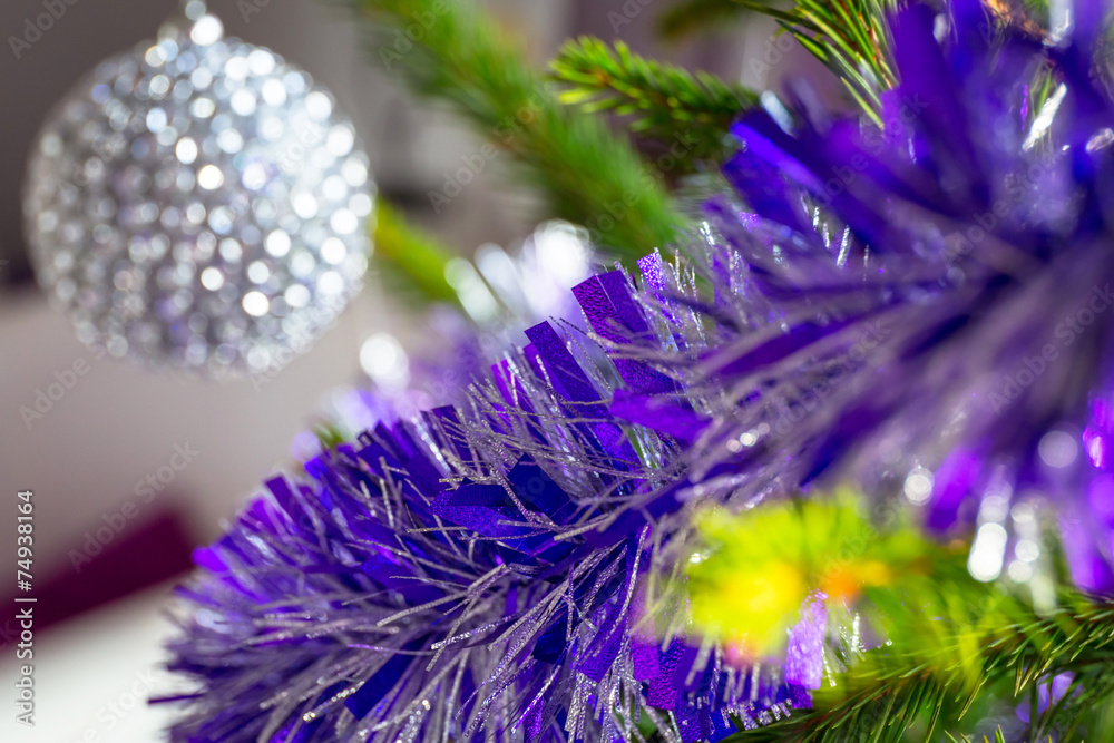 Beautiful purple and silver baubles on Christmas tree