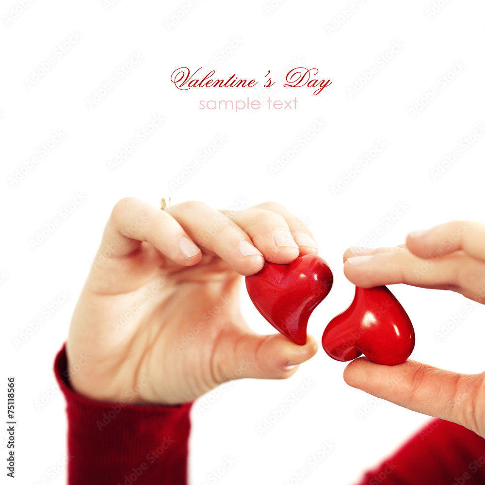 Red hearts  in hands - St. Valentine concept