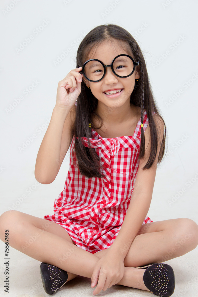 Portrait of little Asian child wearing glasses