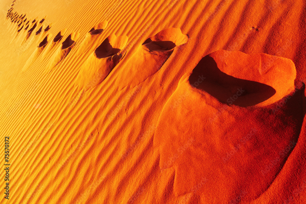 Footprints on sand dune