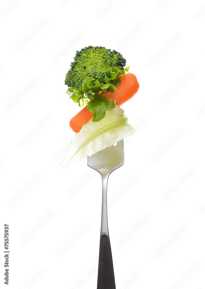 Mixed salad on fork isolated on white