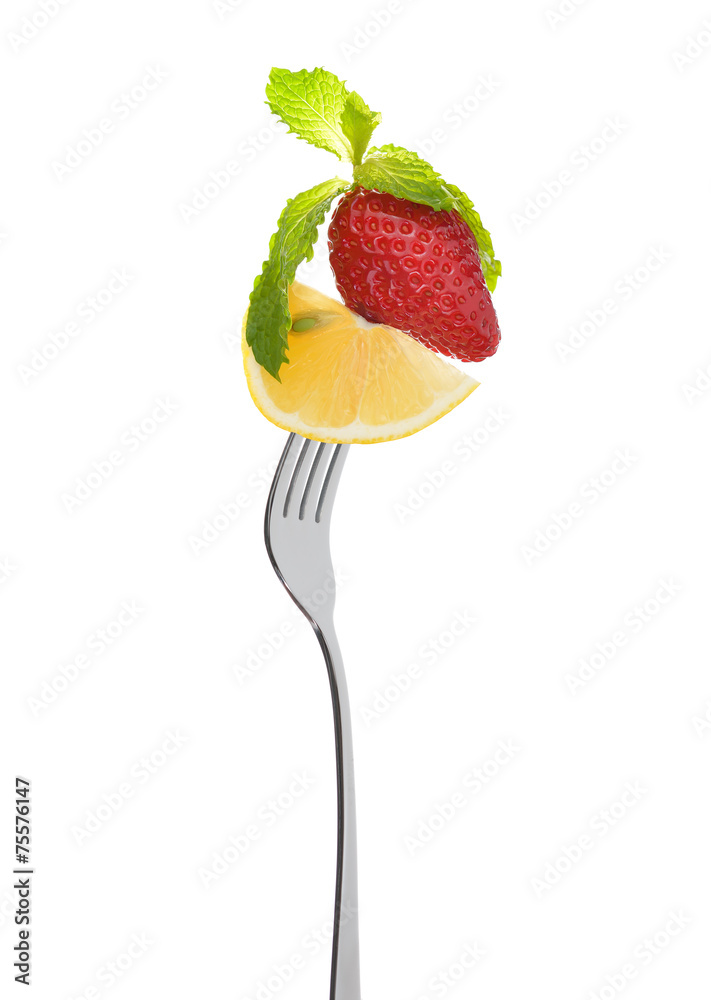 Mixed salad on fork isolated on white