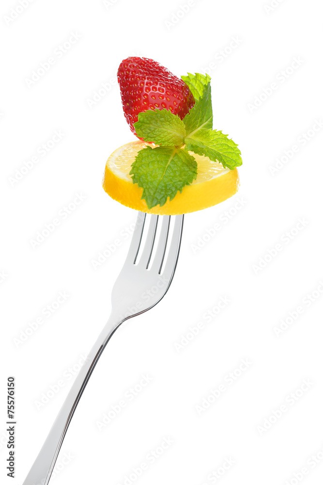 Mixed salad on fork isolated on white