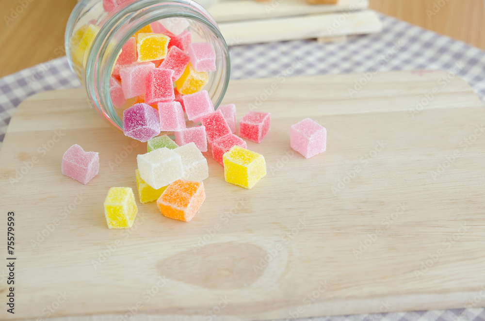 Close of colorful fruit jelly in glass