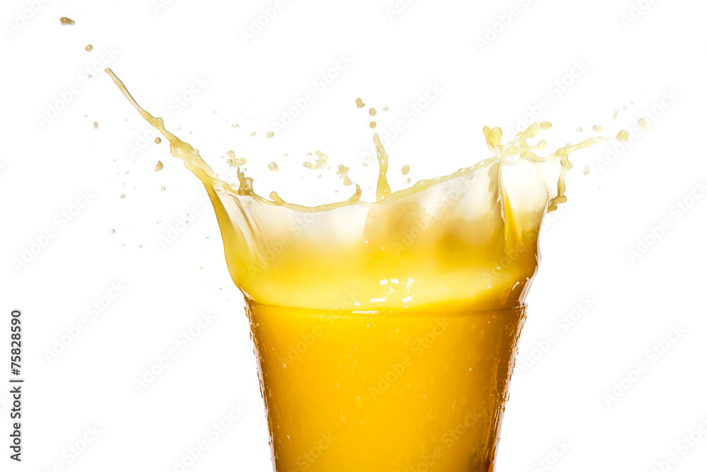 Orange juice. Splash in glass. Isolated on white