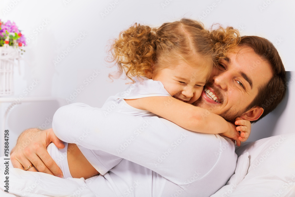 Charming portrait of happy father and  daughter