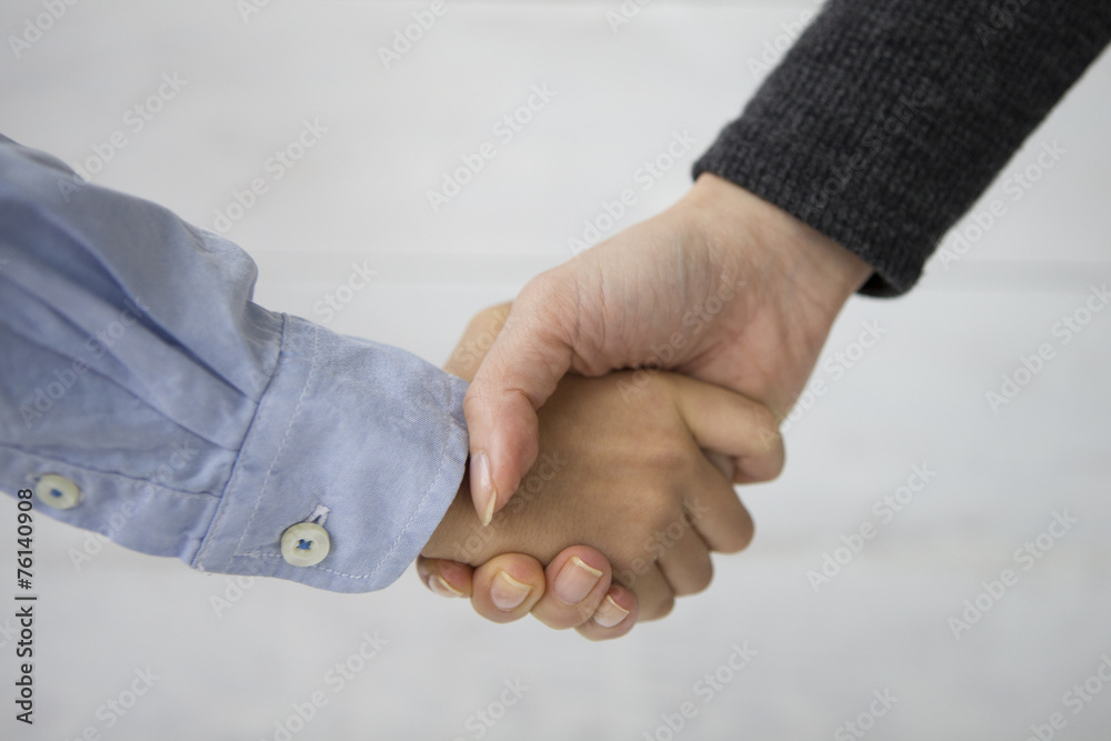 Mother and son shaking hands