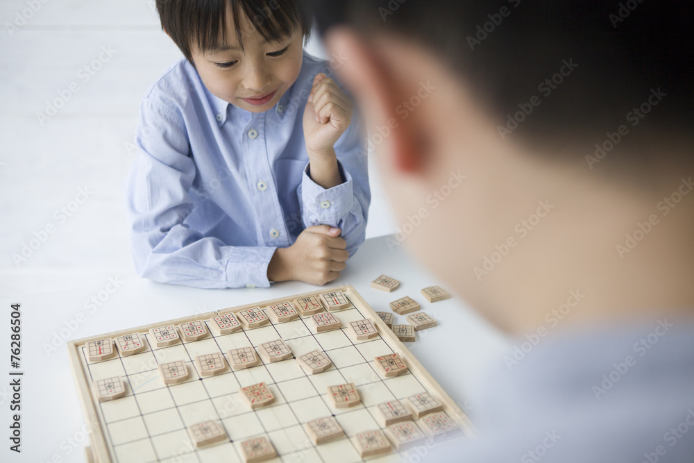 Boy have a chess adults to opponent