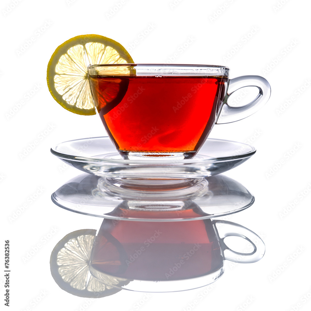 Cup of tea with lemon over white