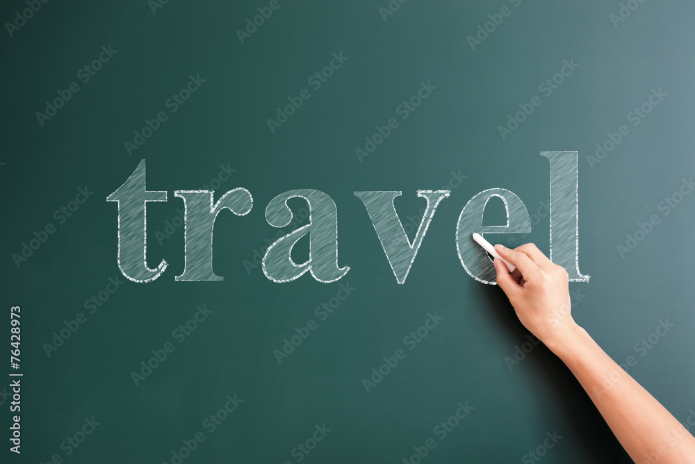 travel written on blackboard