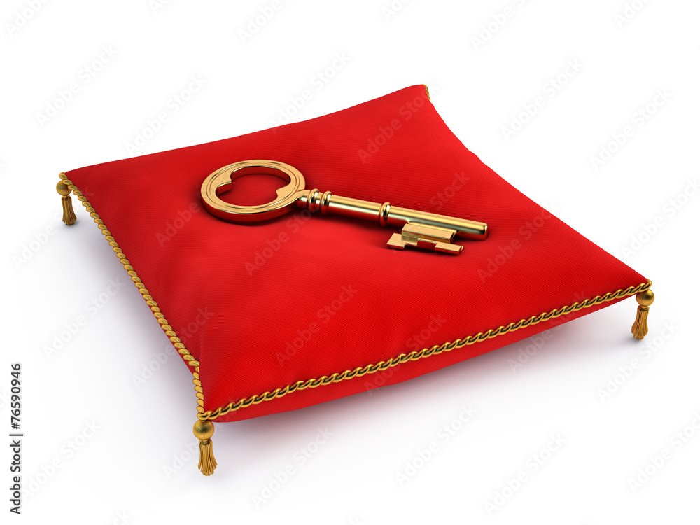 Golden key on red pillow