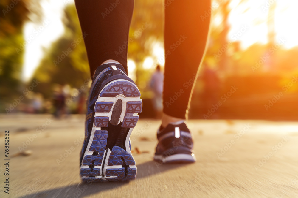 Fitness Girl running at sunset