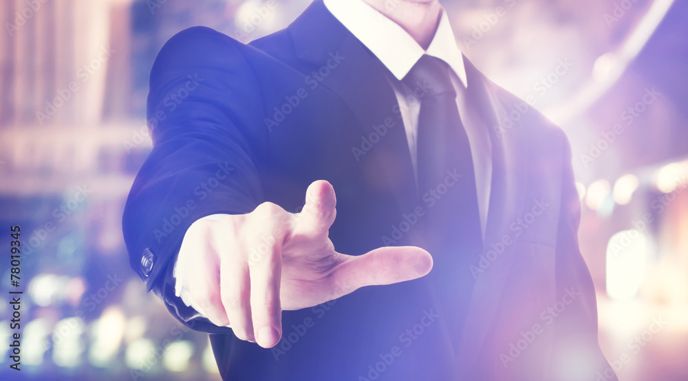 Businessman touching a touch screen