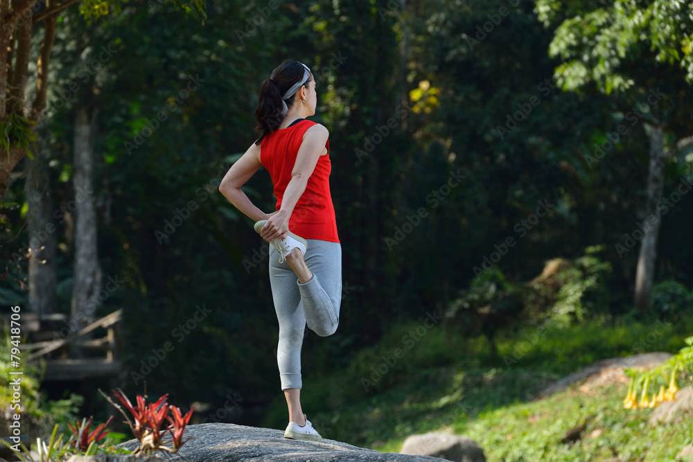 Middle aged woman exercising in the park