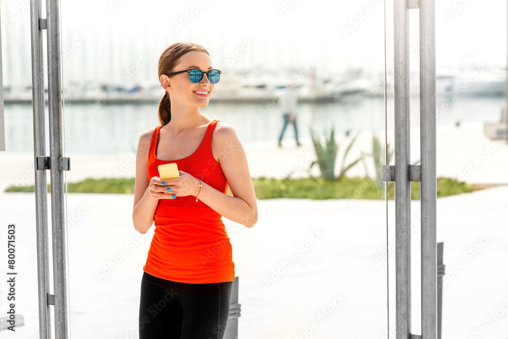 Sport woman at the bus station