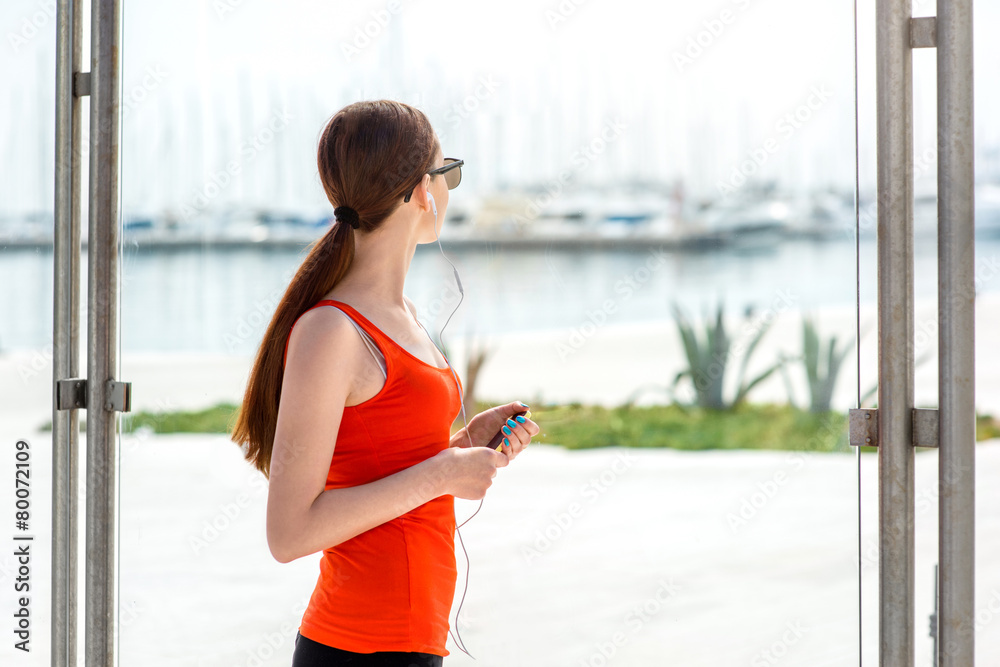 Sport woman at the bus station