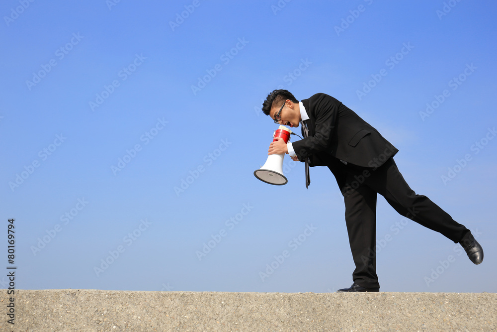 business man using megaphone