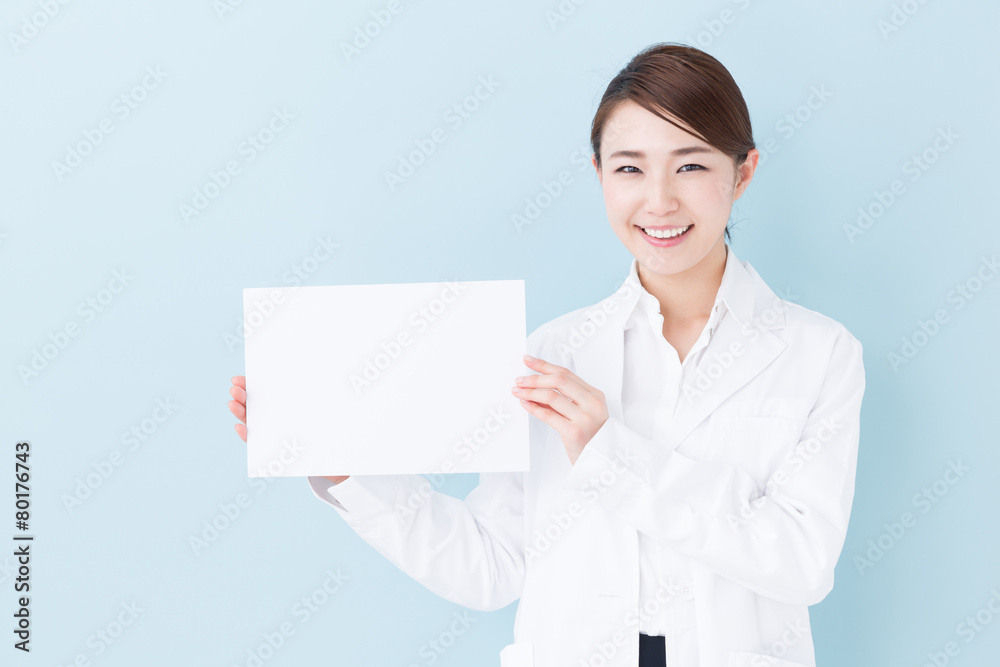 young asian doctor on blue background