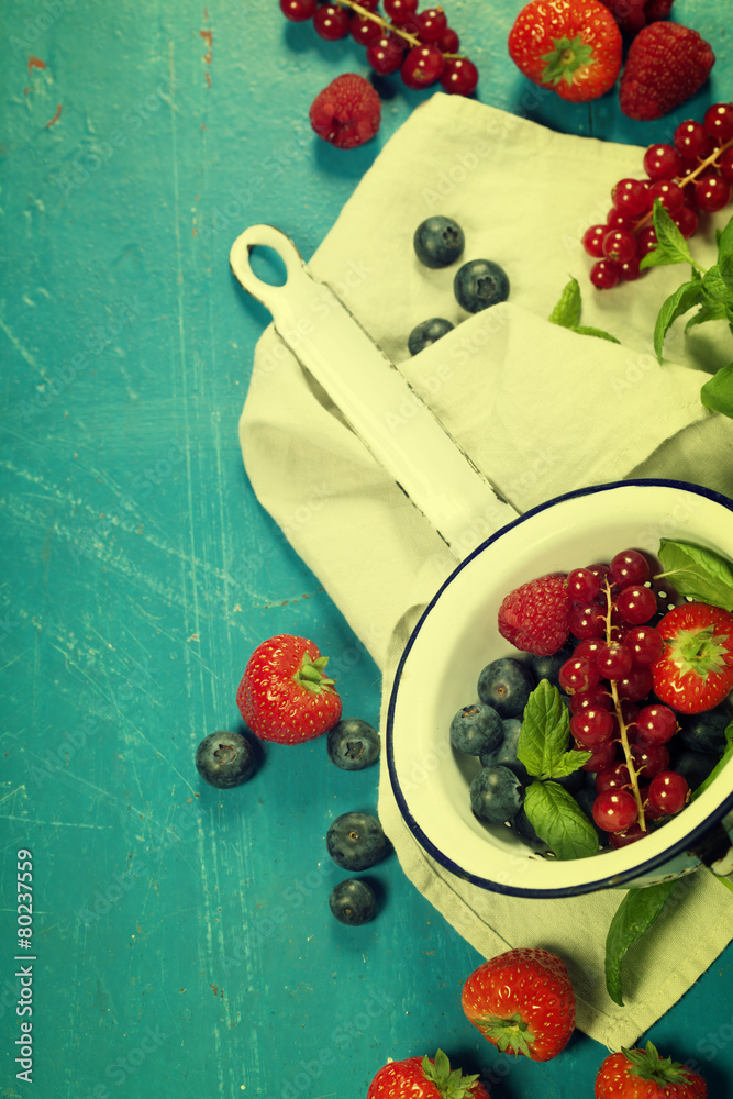 Fresh Berries on Wooden Background. Strawberries, Raspberries an