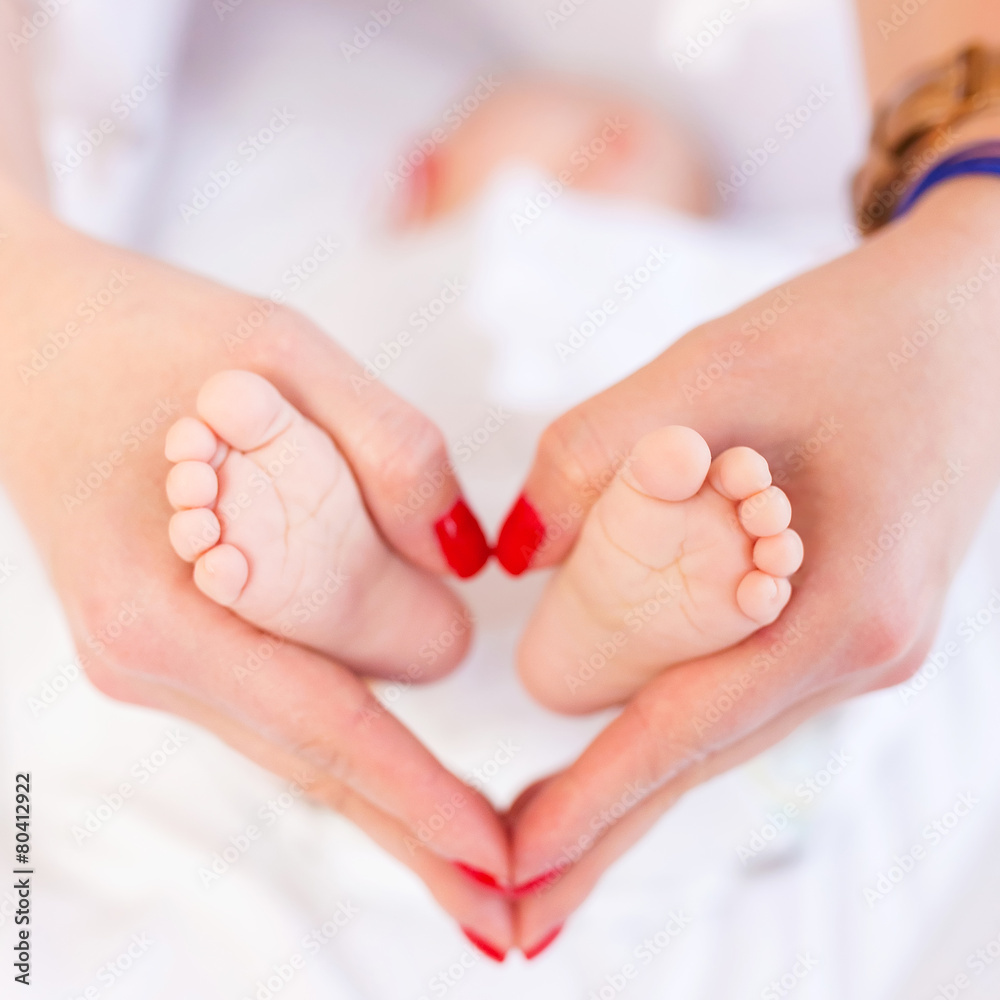 Baby feet in mother hands