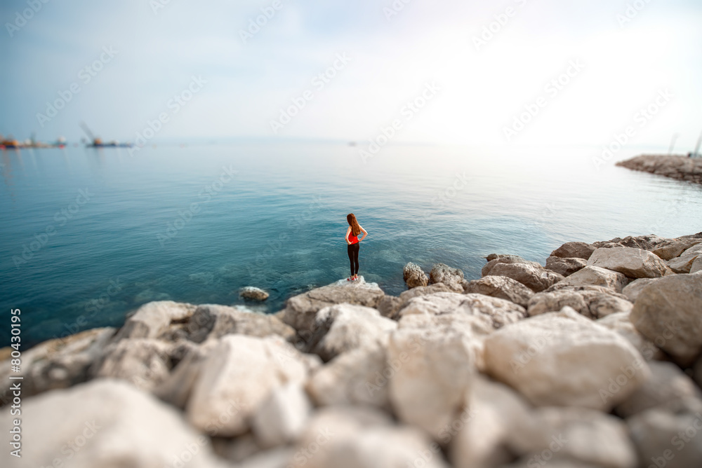 Woman on the rocky beach