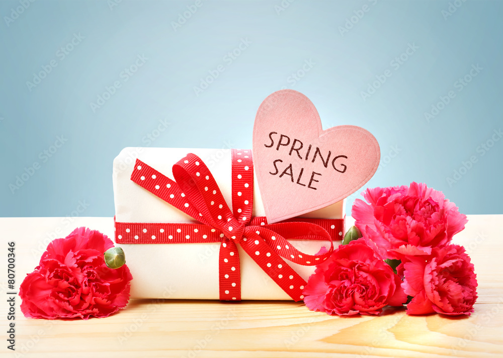 Spring Sale message with gift box and carnations