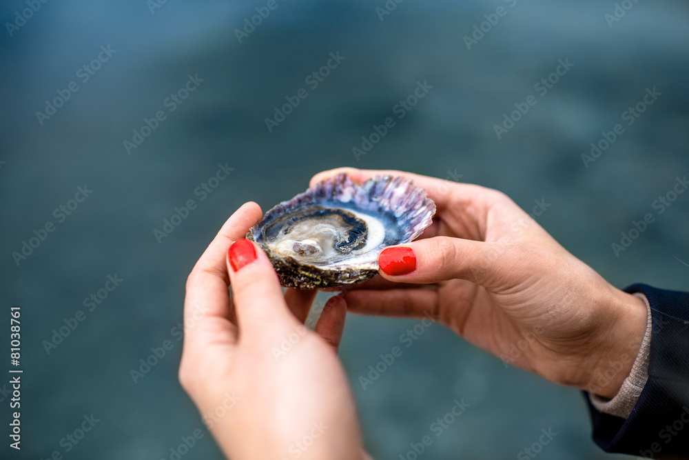 Oyster in hands