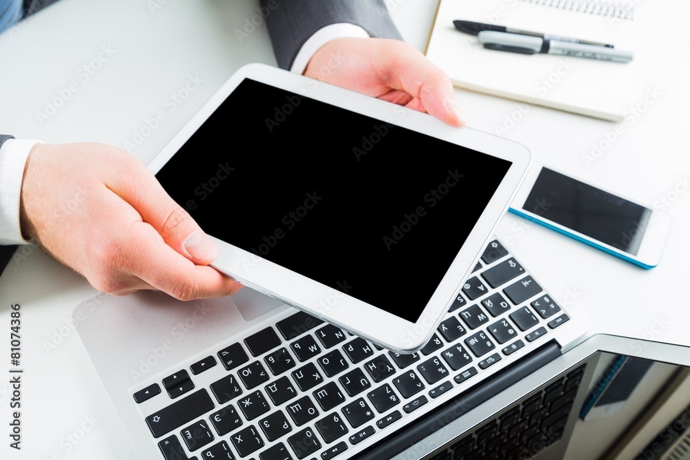 Accounting. Tablet. Man hand working on tablet with blank screen