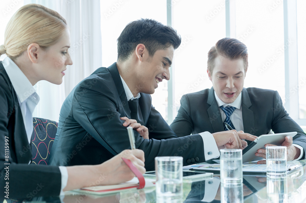 business partners discussing documents and ideas at meeting